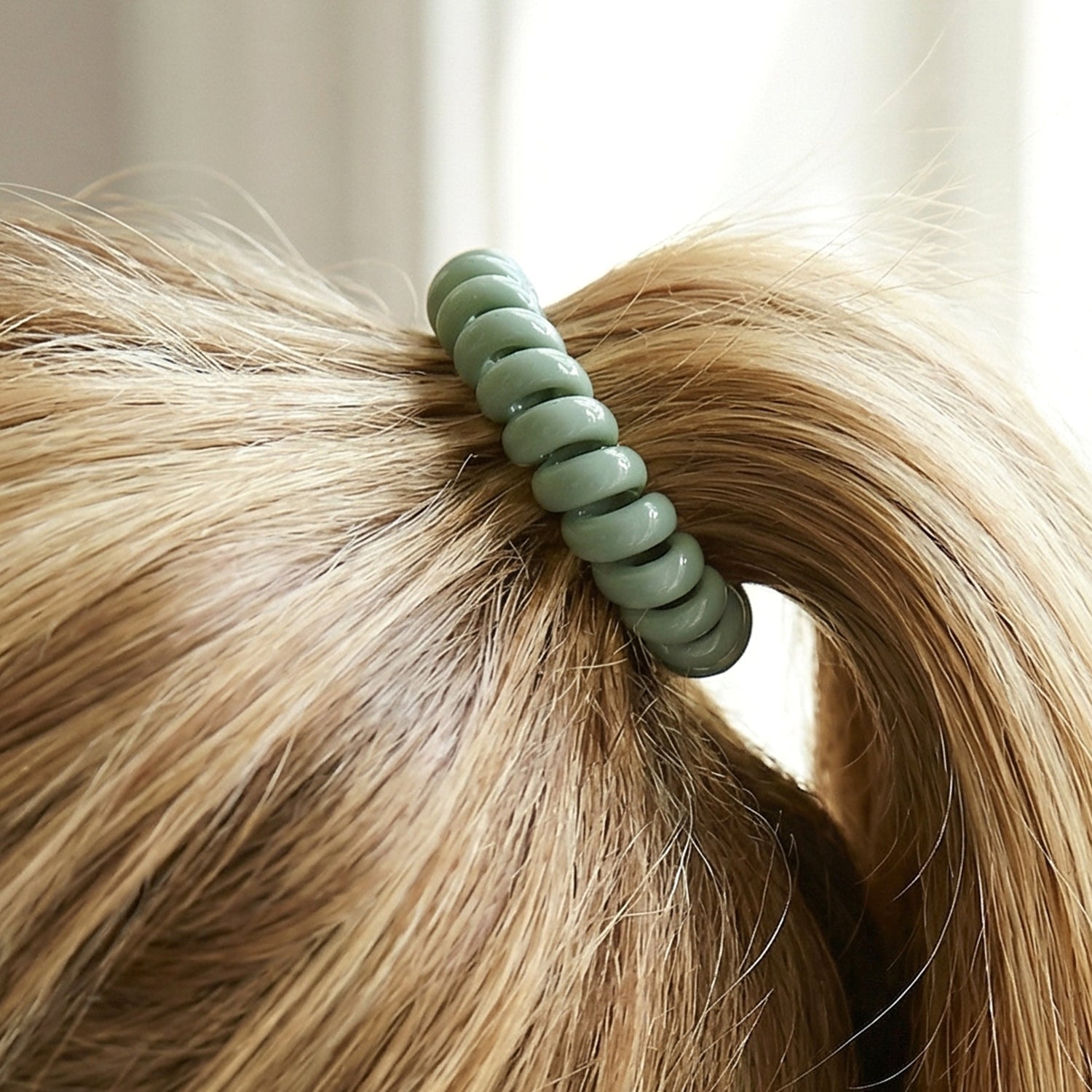 Durable plastic coil hair tie, reduces hair breakage and damage