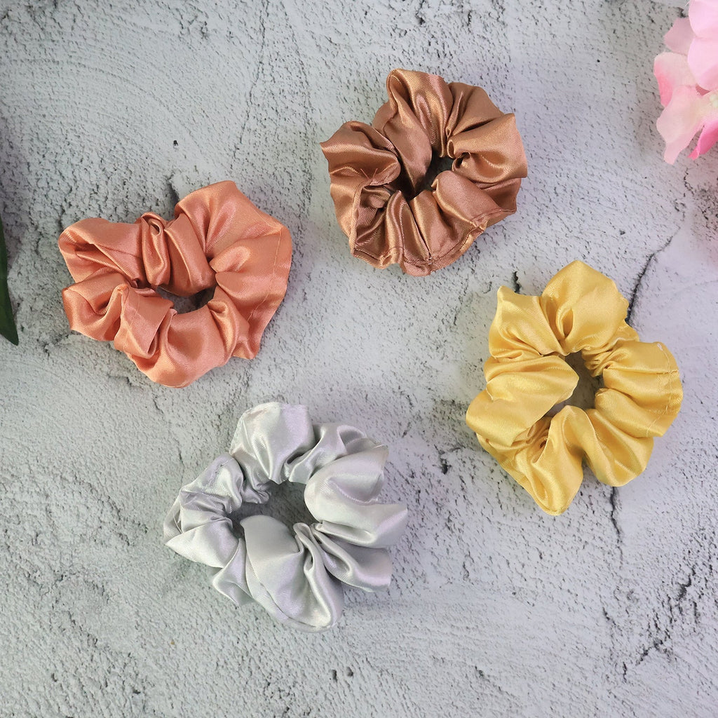 Assorted satin hair scrunchies neatly displayed on a light surface