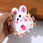 Assortment of small pastel claw hair clips shaped like bears.