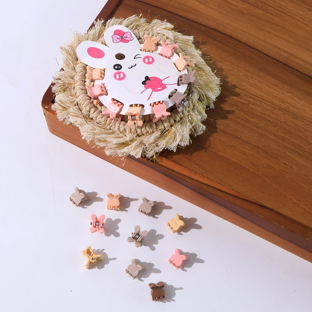 Close-up of assorted pastel-colored bear-shaped mini claw hair clips.