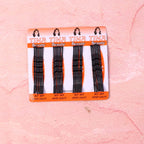 Angled view of black hair bobby pins for hairstyling