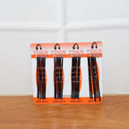 Lifestyle image of black hair bobby pins used in an elegant bun hairstyle