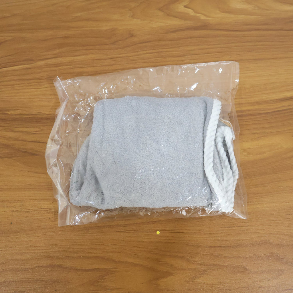 Woman comfortably wearing the turban towel for women while relaxing.