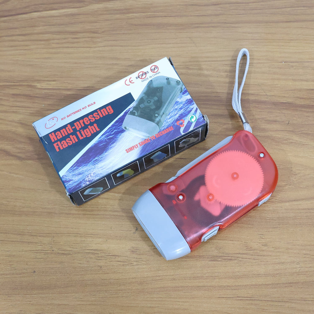 Hand holding battery-free hand press torch showing easy operation and grip