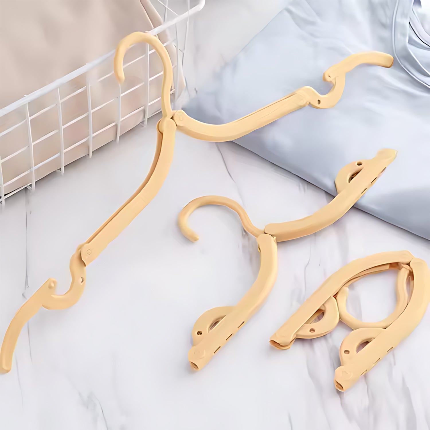Portable folding hanger with rotating hook ideal for travel and home use