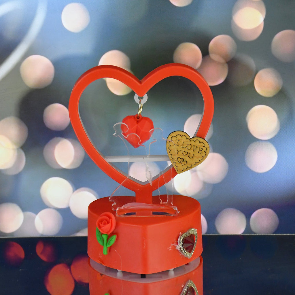 LED light showpiece shaped like a heart with rose accent and hanging love pendants