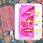 Multiple reusable ice molds on a tray, ready to be filled with juice or puree.