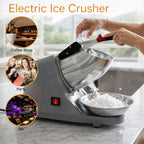 Electric snow cone ice crusher operating for beverages