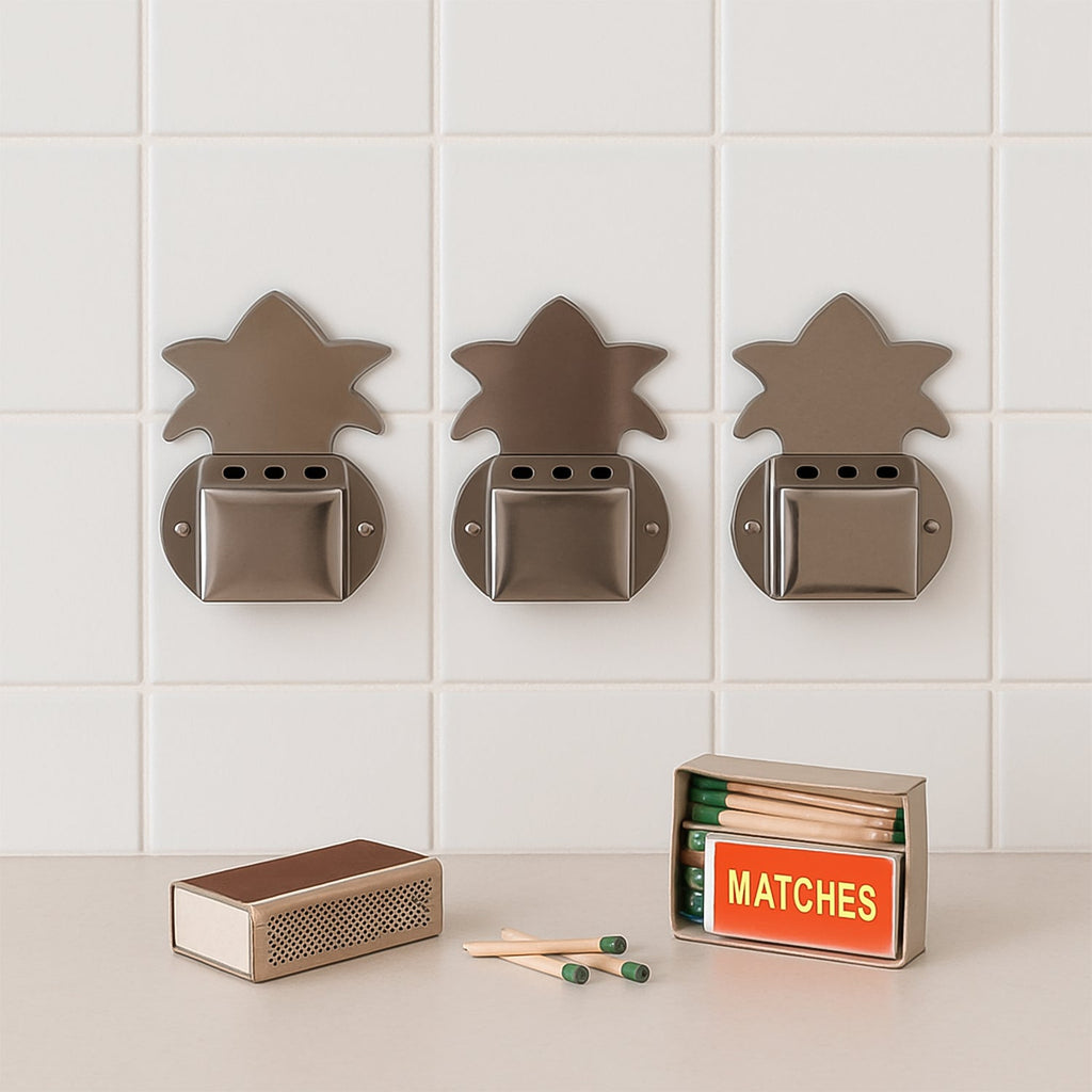 Close-up of metal wall-fixed incense stick holder showing ash collection tray.
