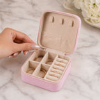 A closed LilyGleam Mini PU Leather Travel Jewellery Box in a stylish pink shade, perfect for organising accessories.