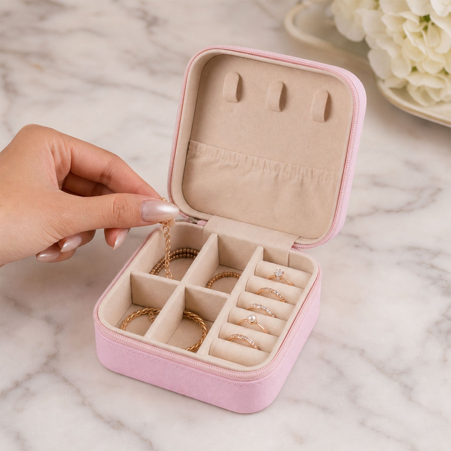 A closed LilyGleam Mini PU Leather Travel Jewellery Box in a stylish pink shade, perfect for organising accessories.