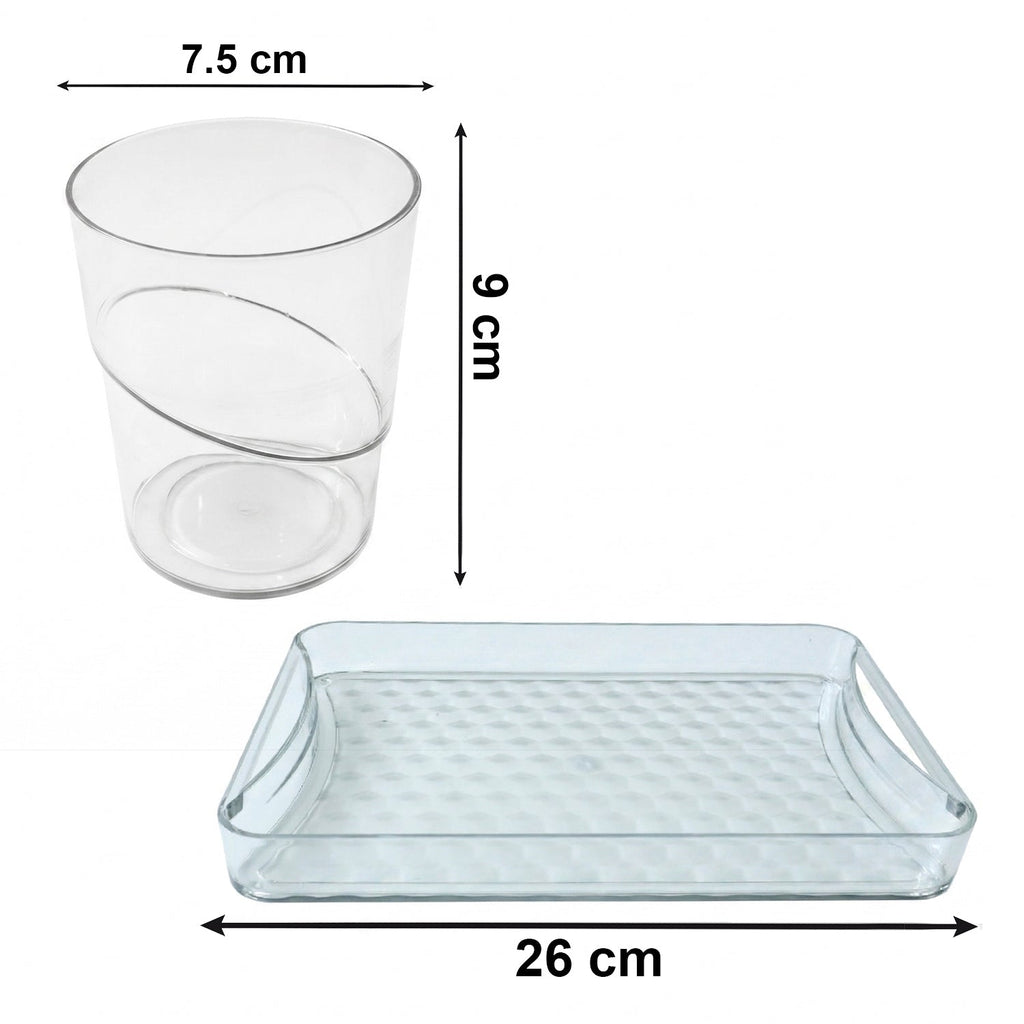 Close-up of transparent glass tumblers with tray