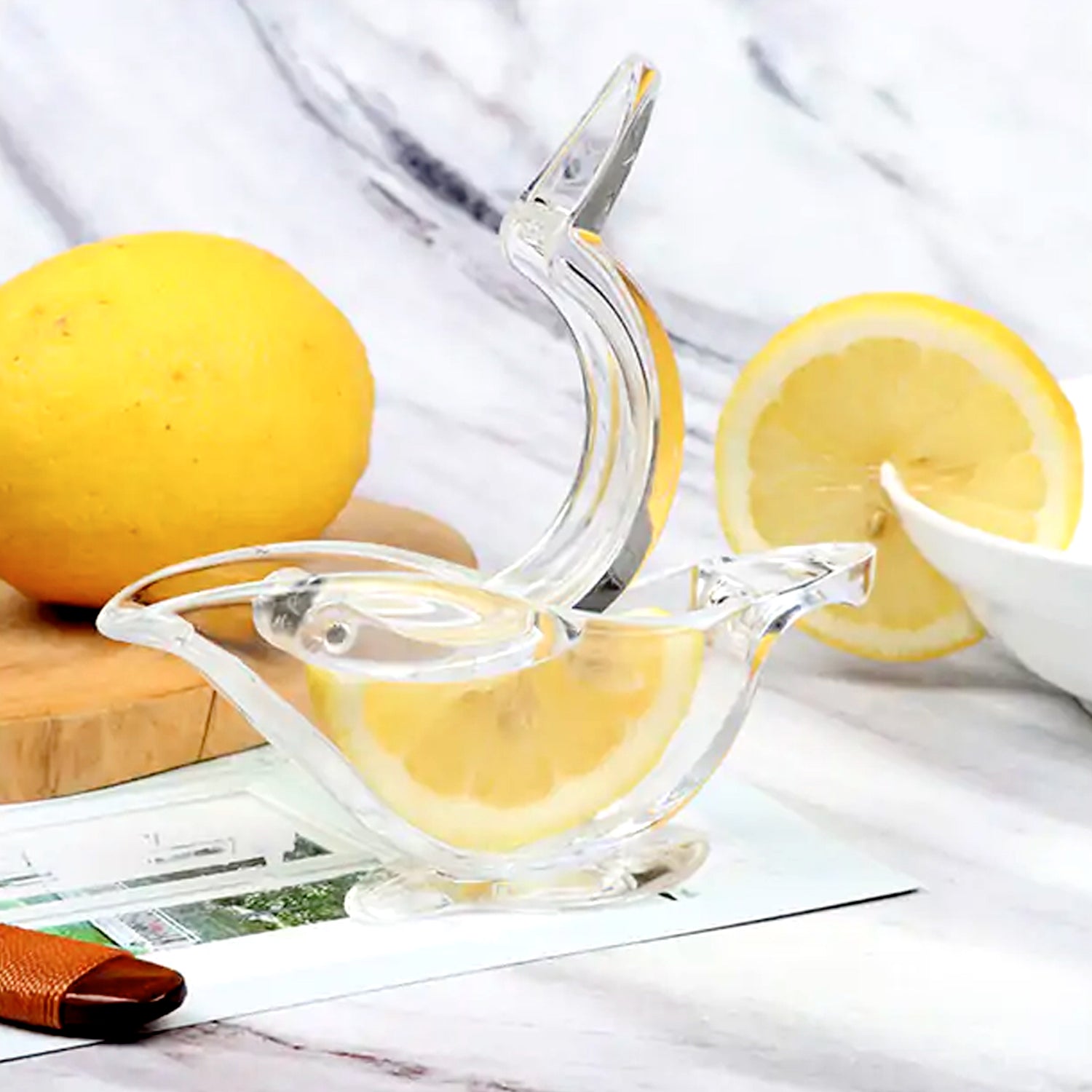 Transparent plastic citrus juicer showcasing its elegant and functional design.