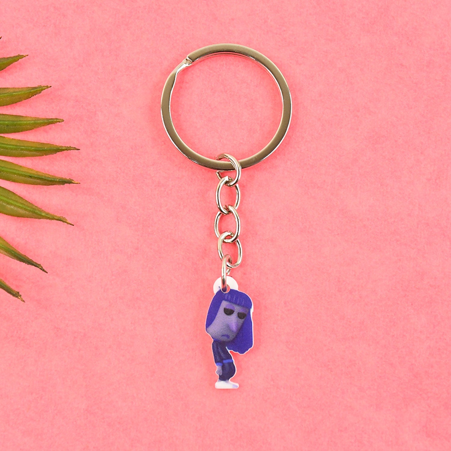 Close-up of big cartoon character keychain showing metal ring