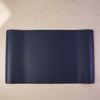 Workspace setup with large desk mat
