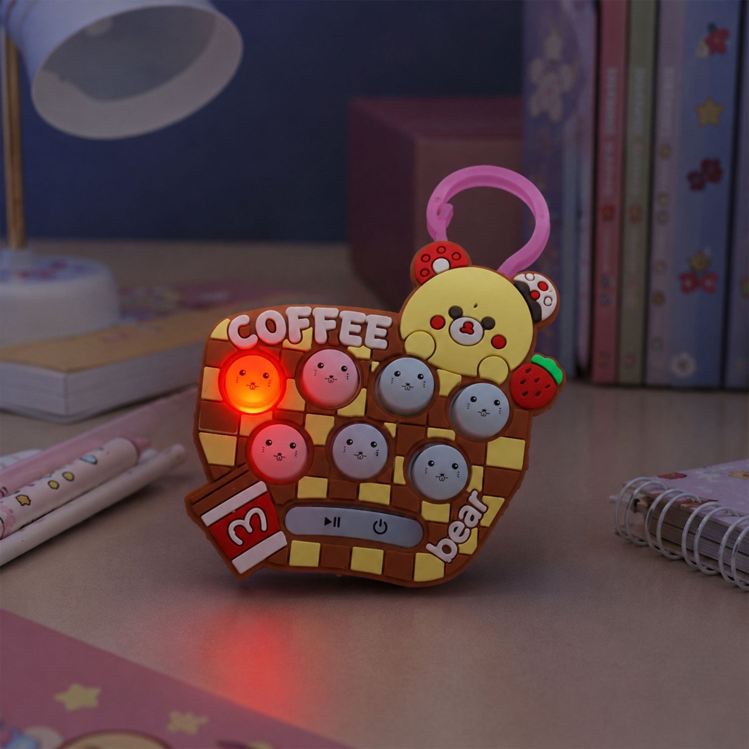 Soft tactile bubbles on unicorn themed push-button keychain toy
