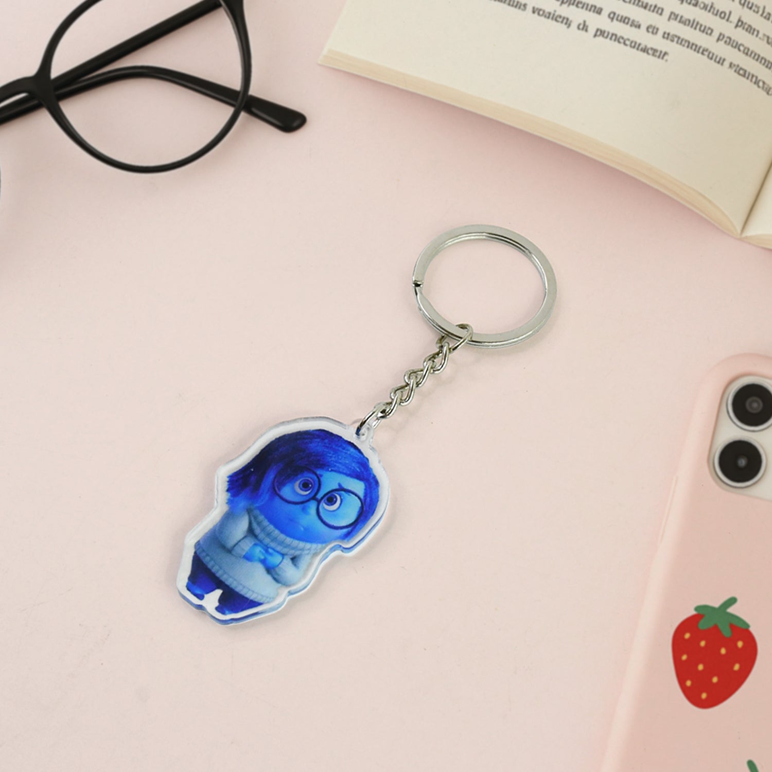 Blue cartoon acrylic keychain charm attached to metal ring
