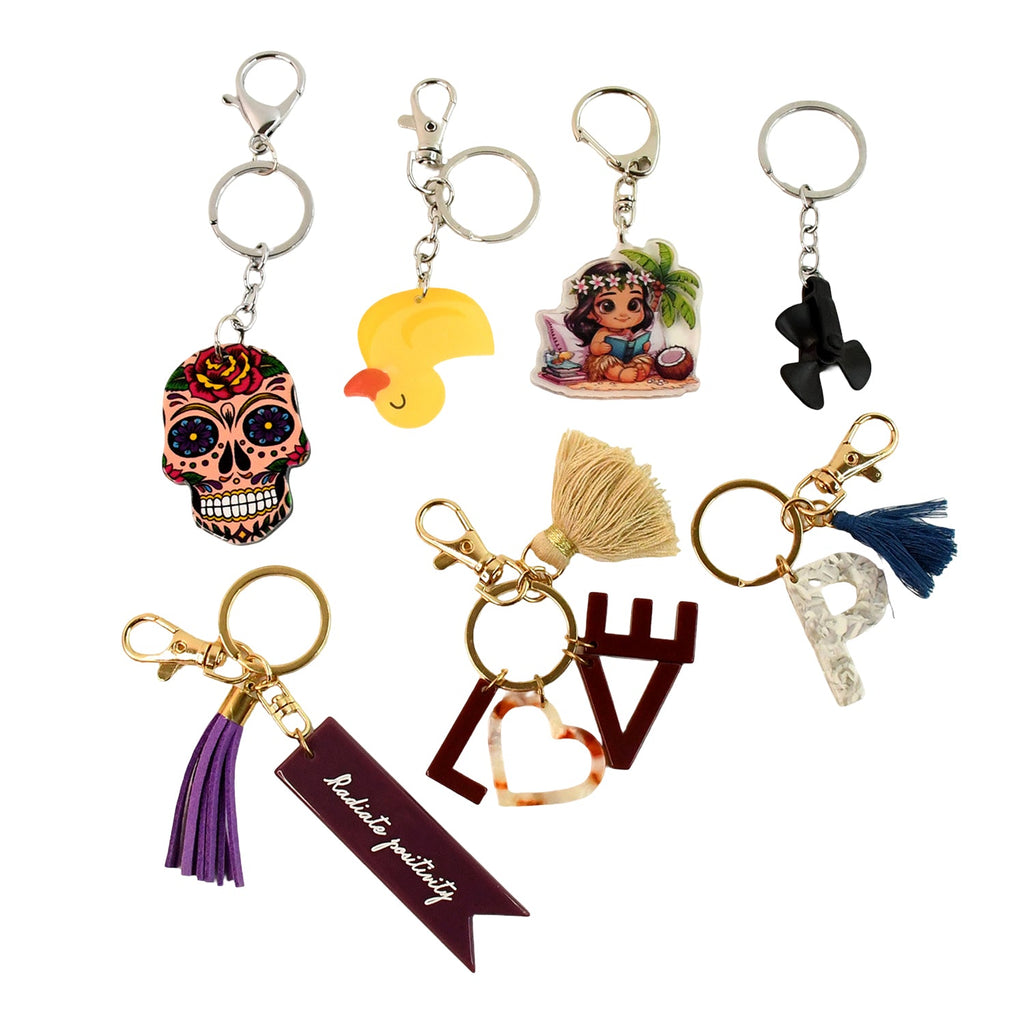 Collection of assorted designer keychains for bags and keys