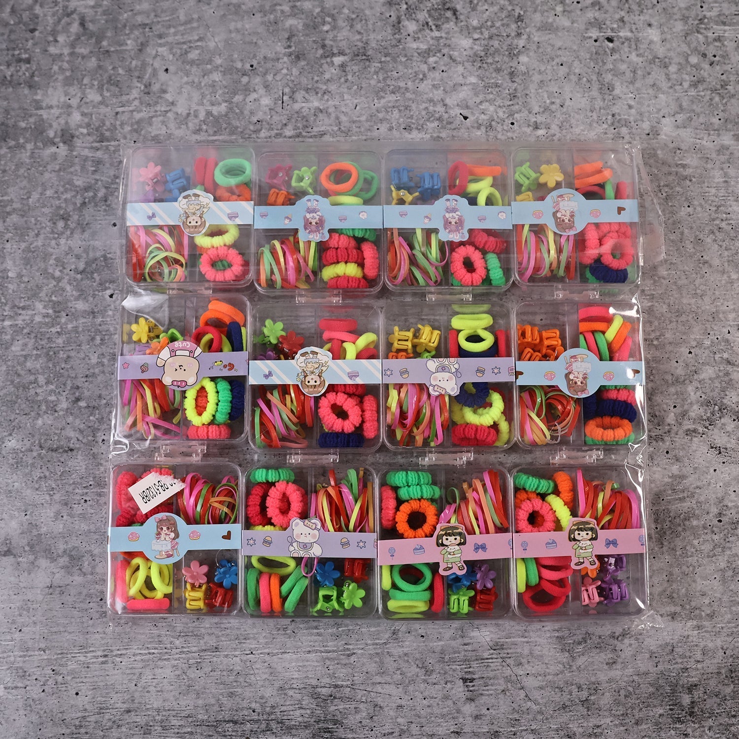 Complete kids hair accessories kit with elastic bands, rubber bands, and decorative clips.