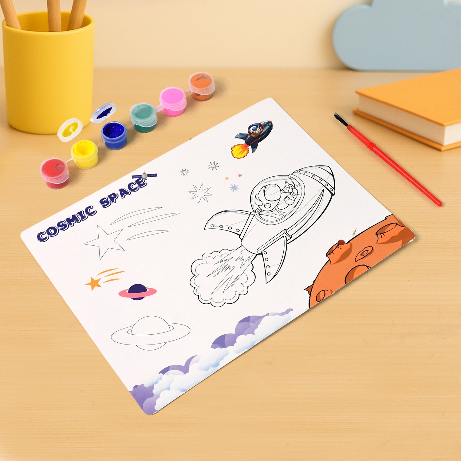 Pre-printed space-themed coloring sheet with rocket and astronaut from kids painting kit