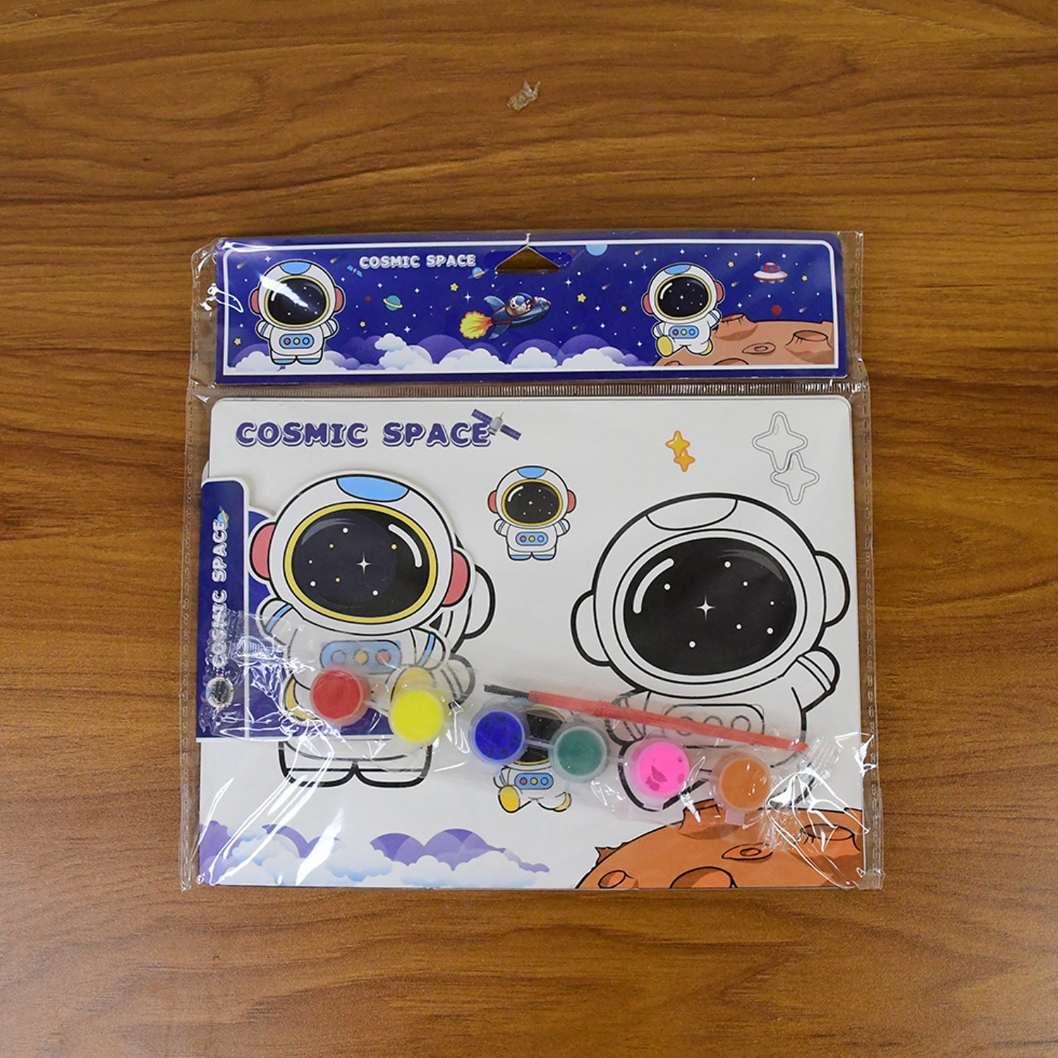 Kids painting and coloring kit artwork showing astronauts and space rockets