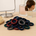 A vibrant pile of multicolour small hairbands for kids, perfect for everyday styling.