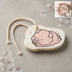Cartoon printed bath scrubber sponge on a white background.