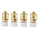 Three vintage lantern-style flameless LED tealights glowing in a dark setting.