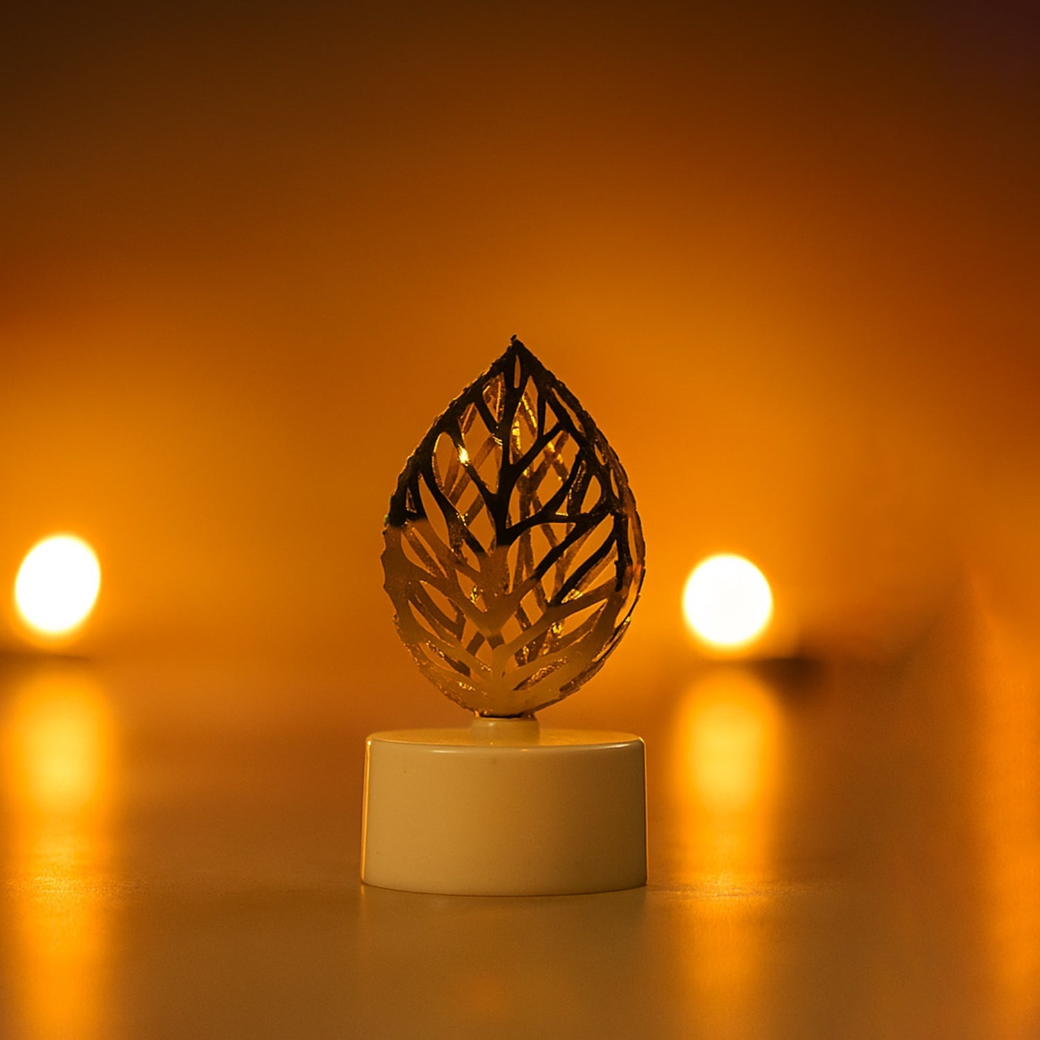 Golden leaf shaped flameless candles arranged for home decoration