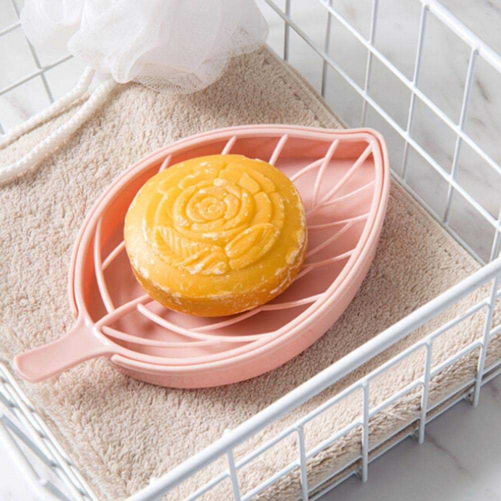 Elegant leaf shape soap holder in a modern bathroom setting.