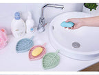 Durable plastic leaf soap holder with a clean, minimalist design.
