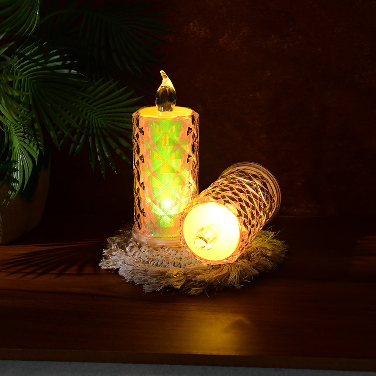 Close-up of decorative LED candle lights showing holographic finish and flicker