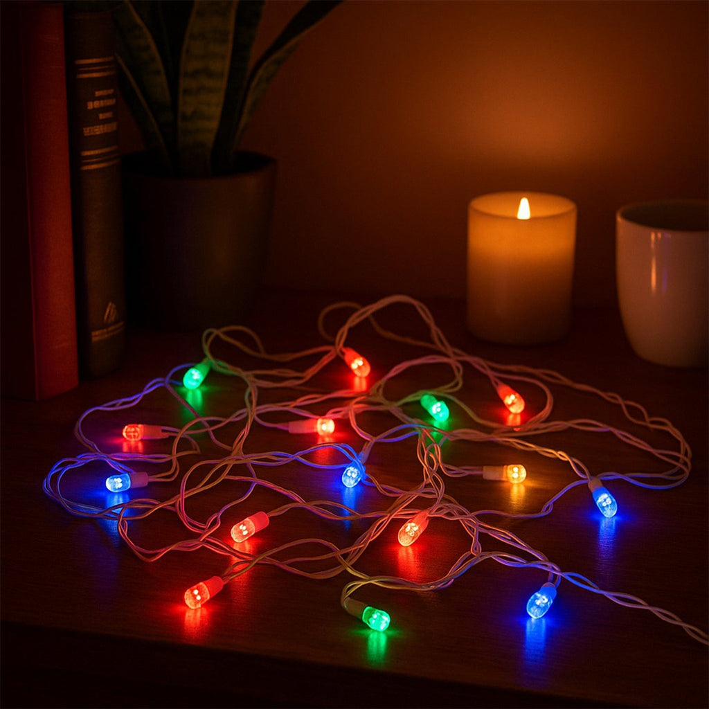 Close-up view of colorful LED bulbs on string light
