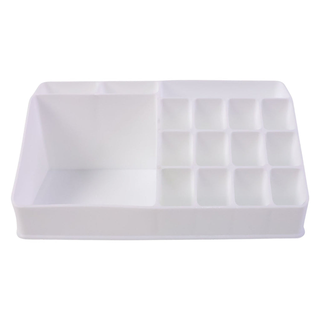 Pull-out drawer of the clear makeup organiser holding compacts and small items.