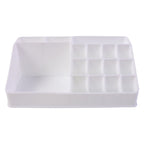 Pull-out drawer of the clear makeup organiser holding compacts and small items.