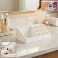 Clear makeup organiser with a drawer and multiple top compartments.