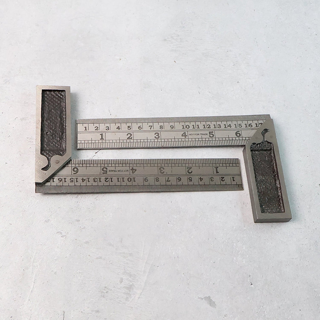 Two-piece metal try square ruler set showing accurate etched inch and centimeter measurements