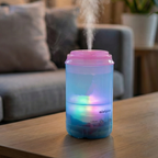 Close-up of the quiet mini humidifier releasing soothing cool mist.