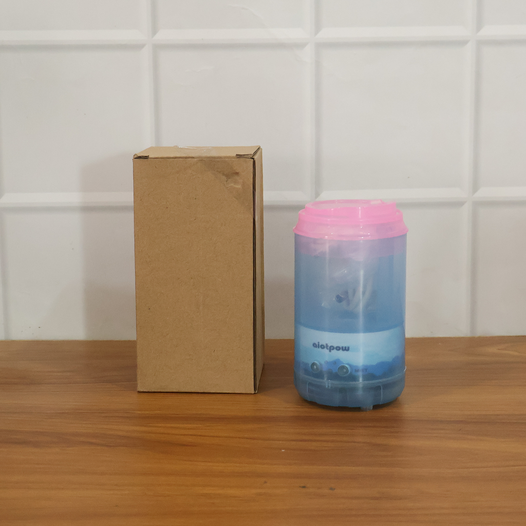 Portable Mini Humidifier providing comfort and aromatherapy in a bedroom.