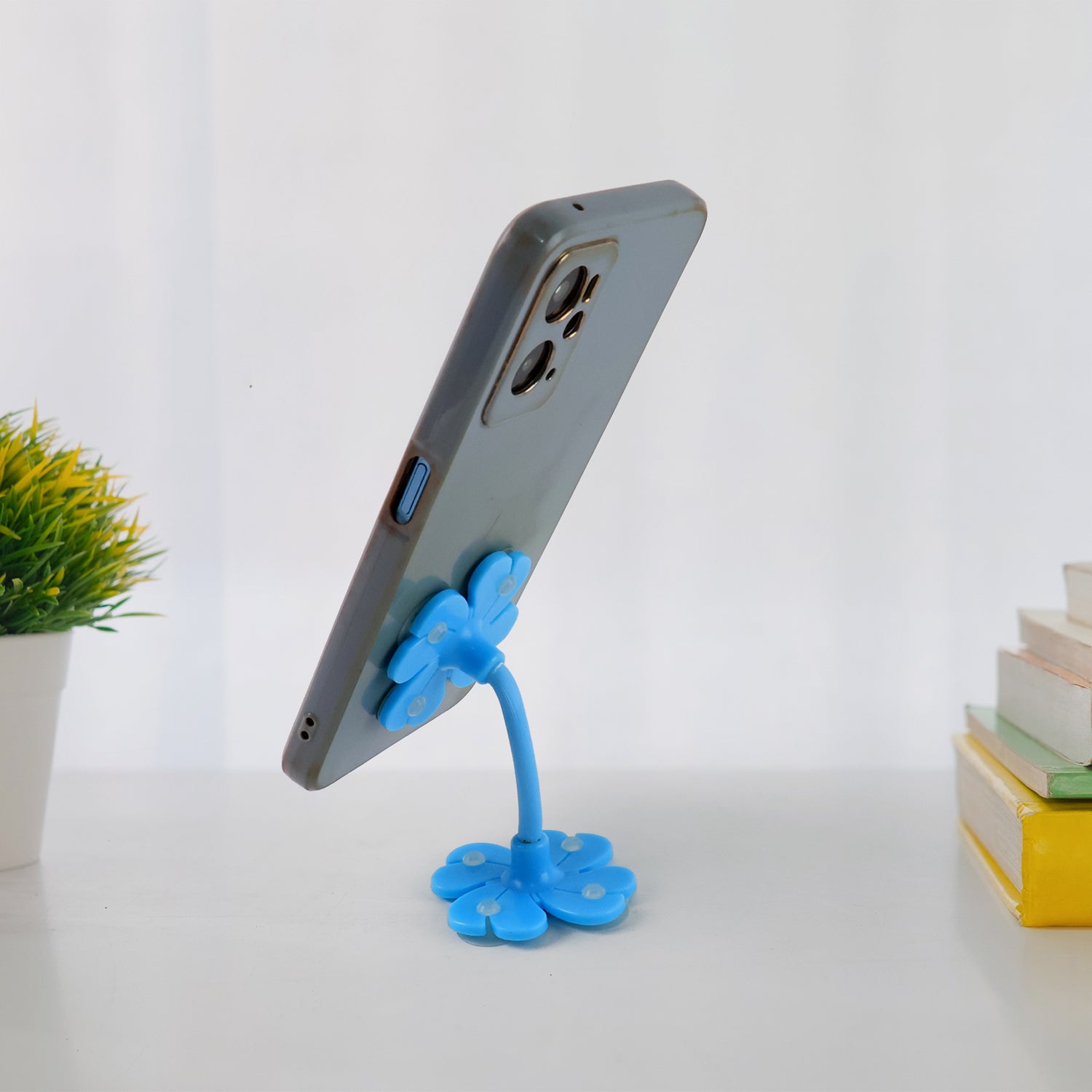 Compact and lightweight car phone mount held in hand, highlighting its portability.