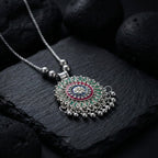 Antique silver-tone floral mandala pendant necklace with enamel accents and hanging ghungroo beads