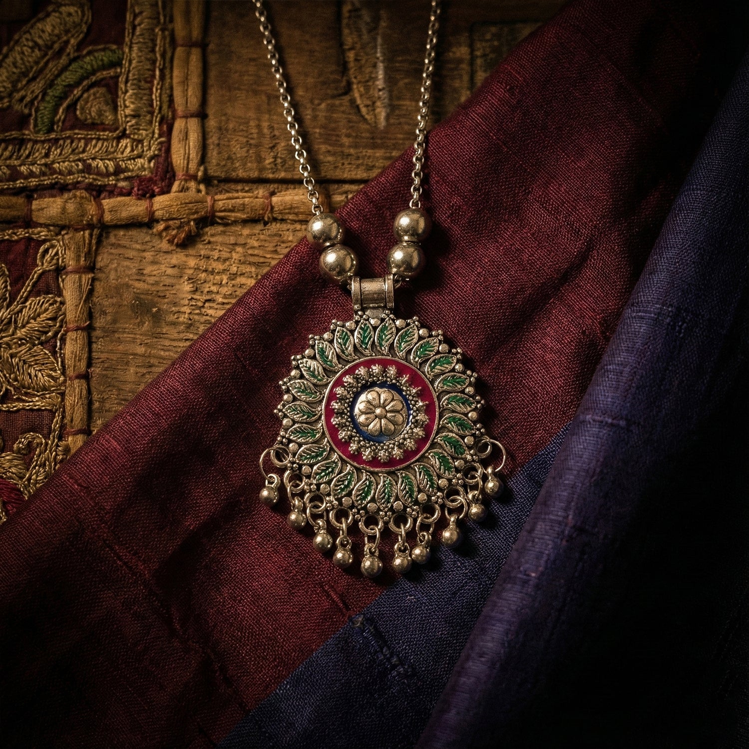 Oxidized silver-tone floral mandala pendant necklace displaying intricate enamel detailing