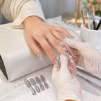 Variety of glitter press-on false nails featuring multiple colorful designs