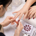 Long coffin press-on nail showcasing a romantic 3D heart pattern close-up