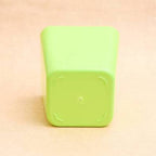 Modern square plastic planter ideal for various indoor plant setups.