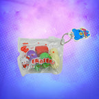 Mini fruit erasers, including strawberry and banana, attached to a pencil, highlighting their use.