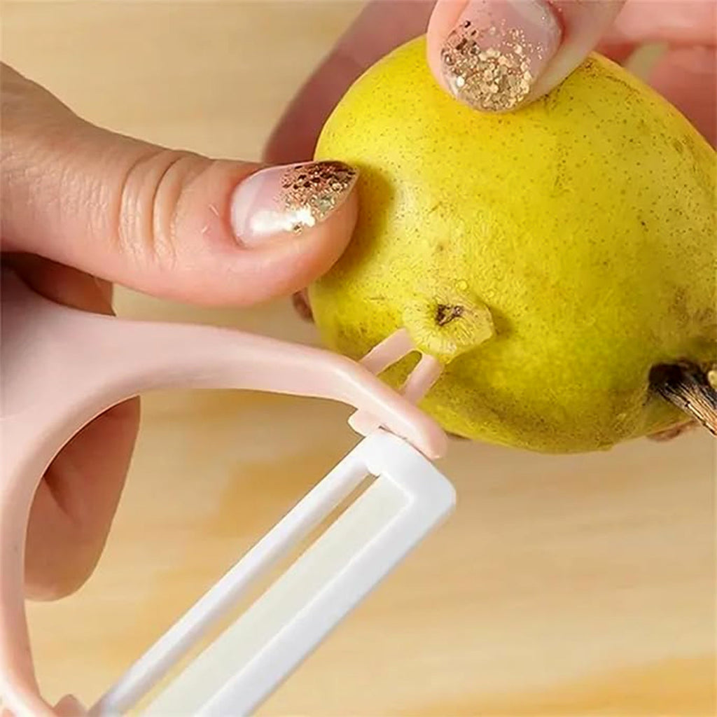 The versatile vegetable peeler alongside a pile of freshly peeled veggies.