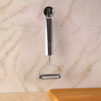 Heavy duty stainless steel vegetable peeler showing sharp dual blades