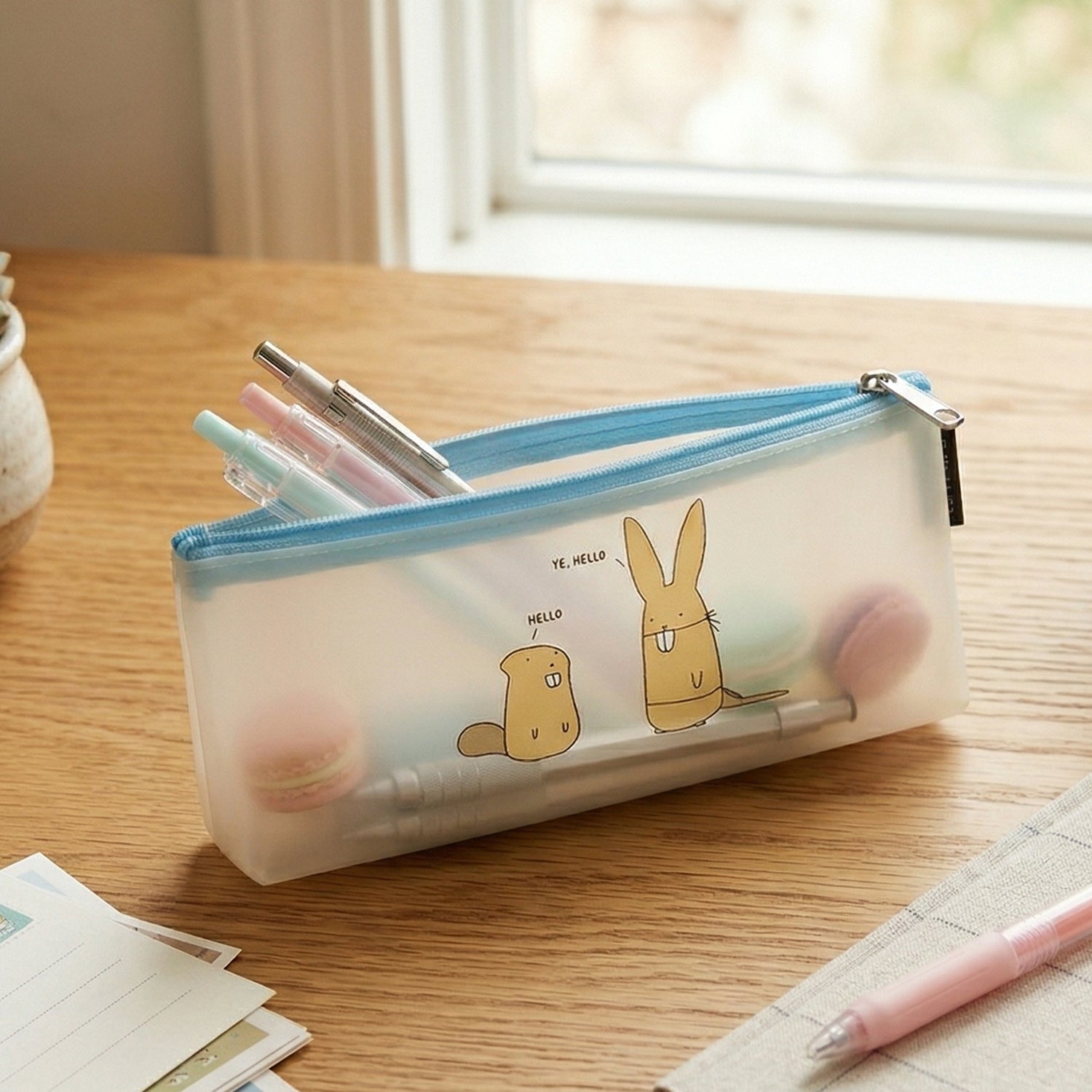 Transparent stationery organizer pouch with secure zipper and playful cartoon print