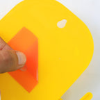Detailed view of wall mounted mobile phone holder with attached hook